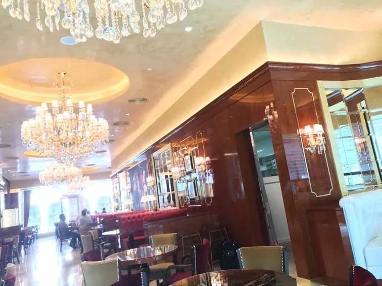 Cafe Concerto interior with timber joinery and gilded ceiling detail