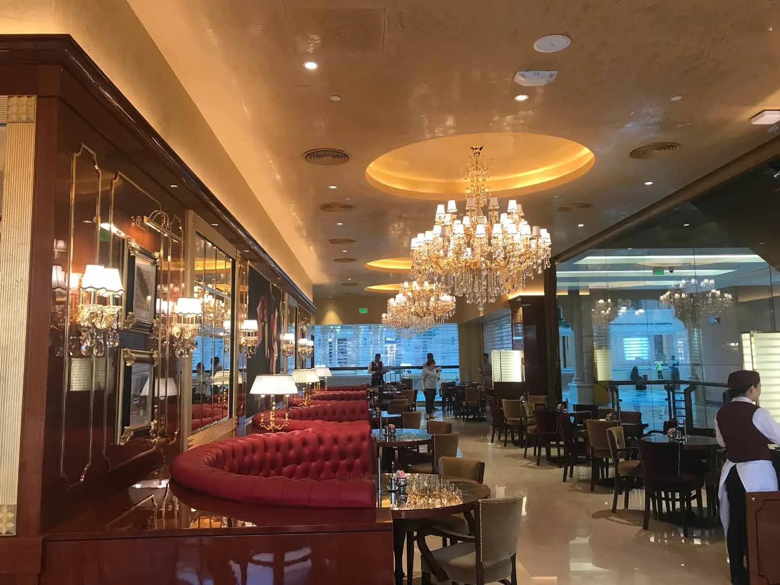 Cafe Concerto dining room with round upholstered benches