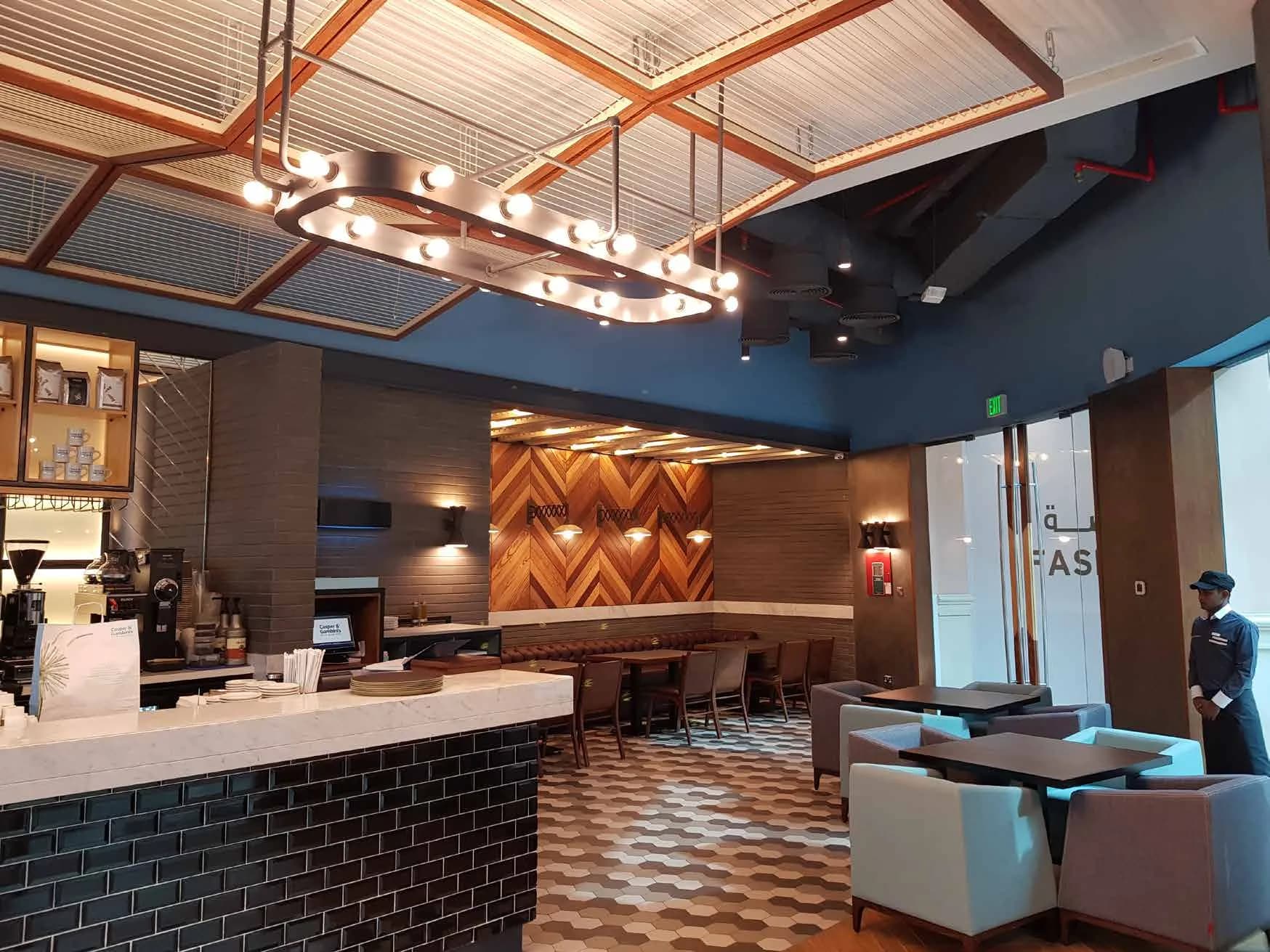 Casper & Gambini's counter with steel structure and custom pendants