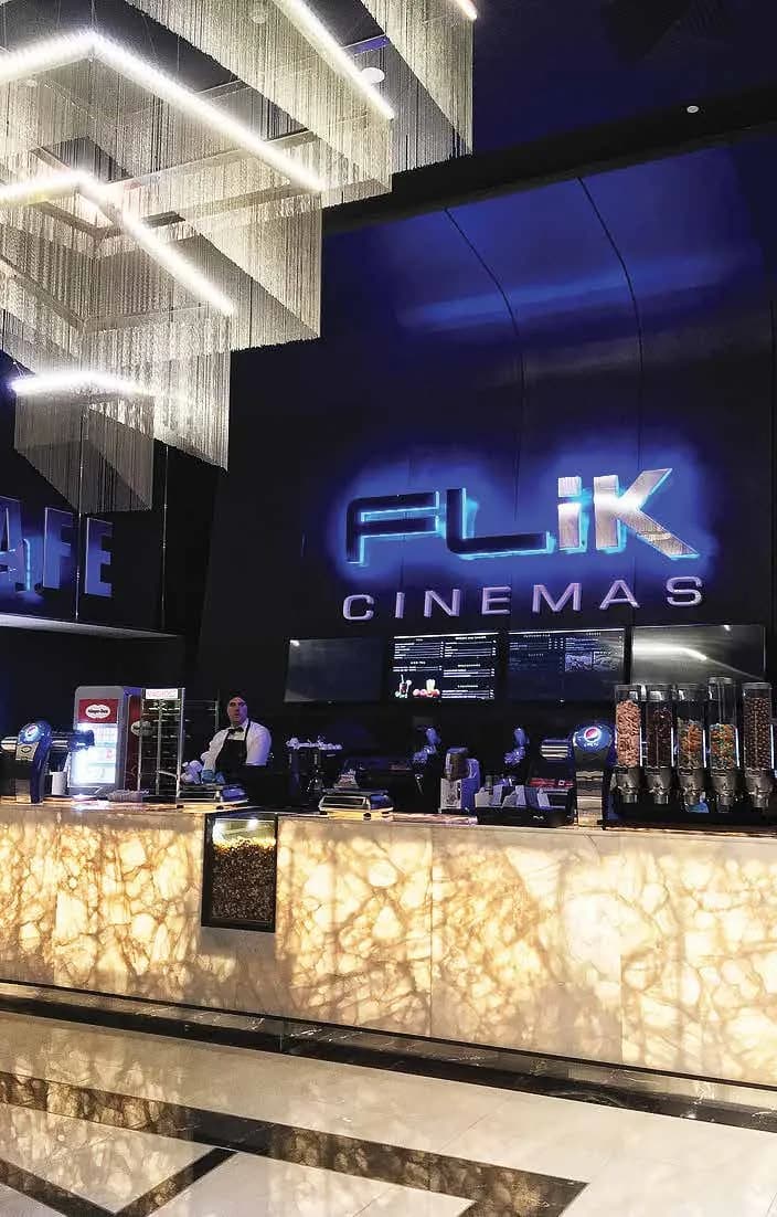 Flik Cinemas entrance signage above the concession bar