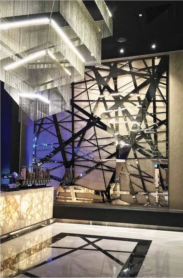 Blackened steel feature structure in the Flik Cinemas foyer