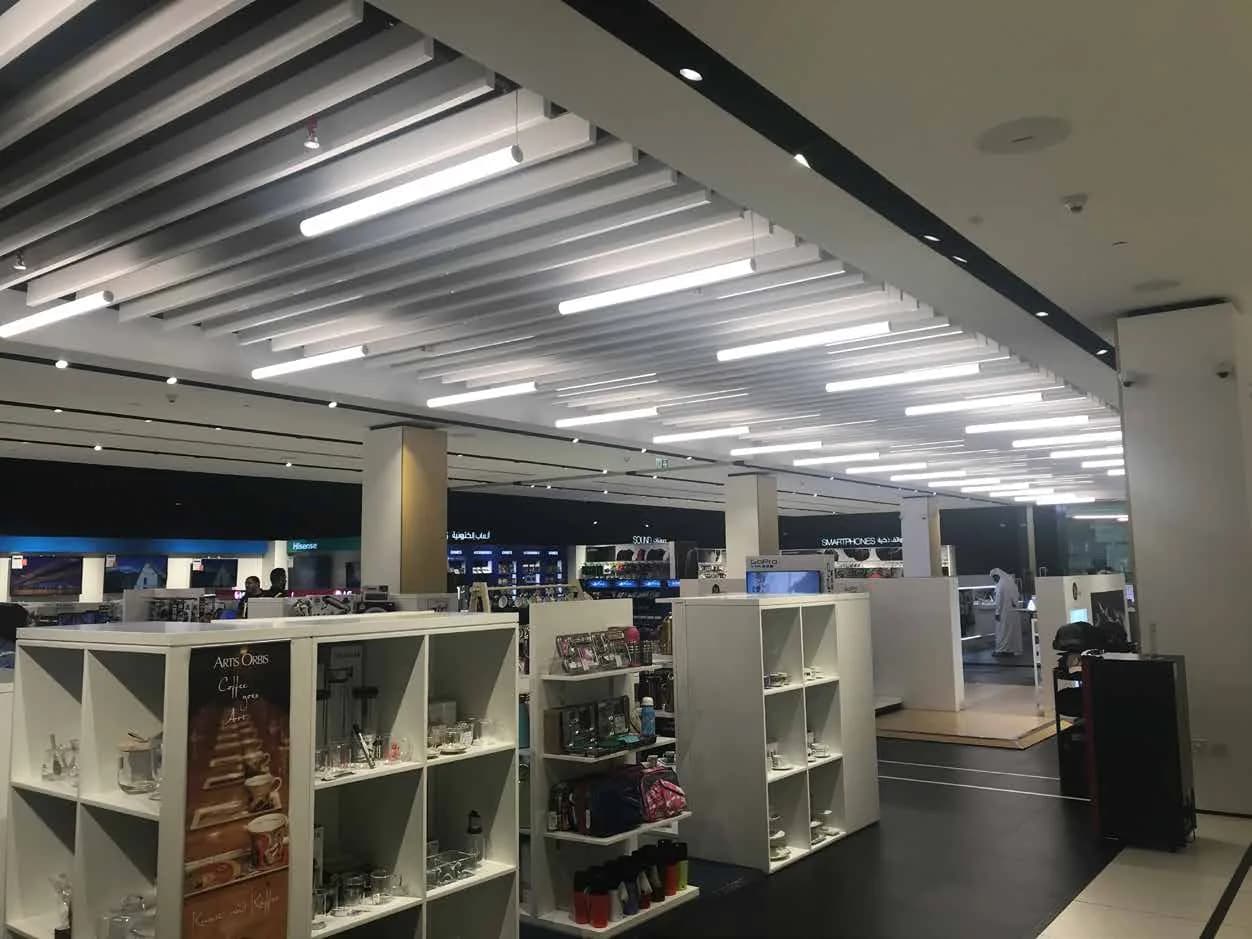 FNAC electronics department with low display units and linear lighting