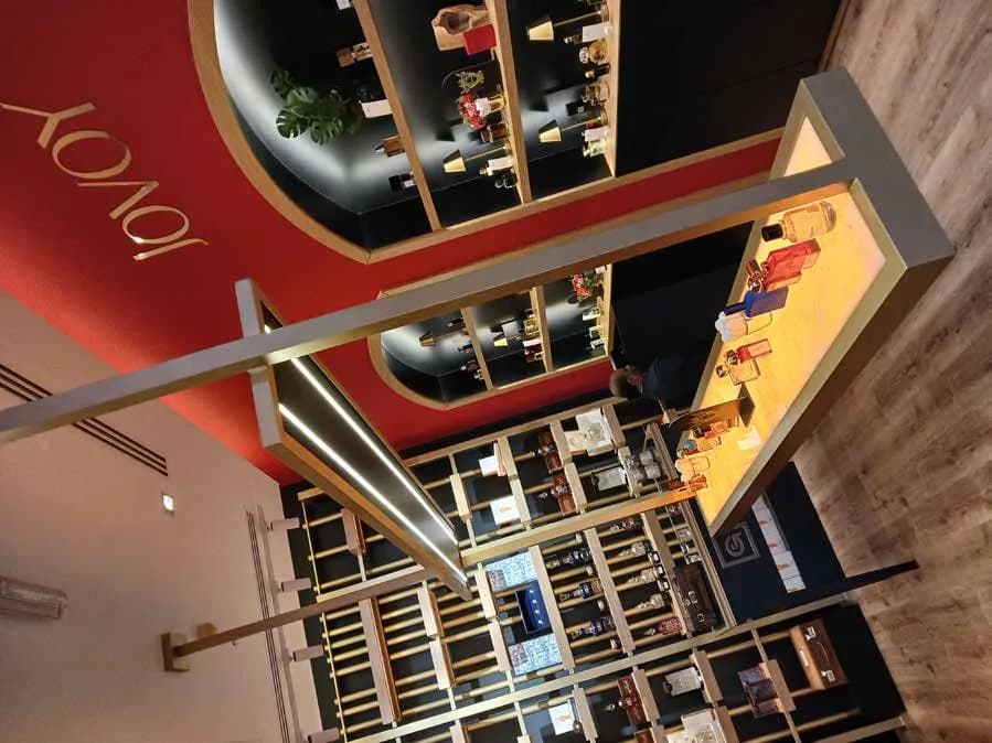 Jovoy shopfront with brand signage and arched entrance