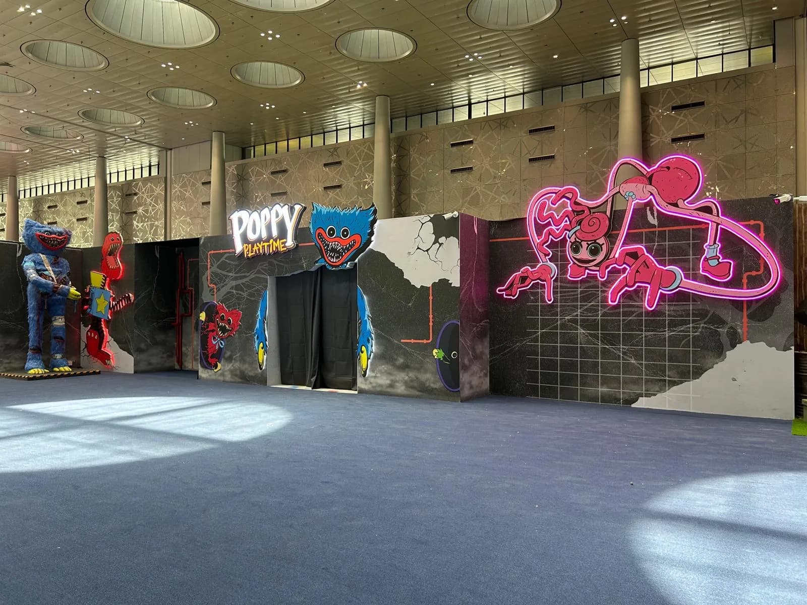 Poppy Playtime activation with neon character artwork and entrance