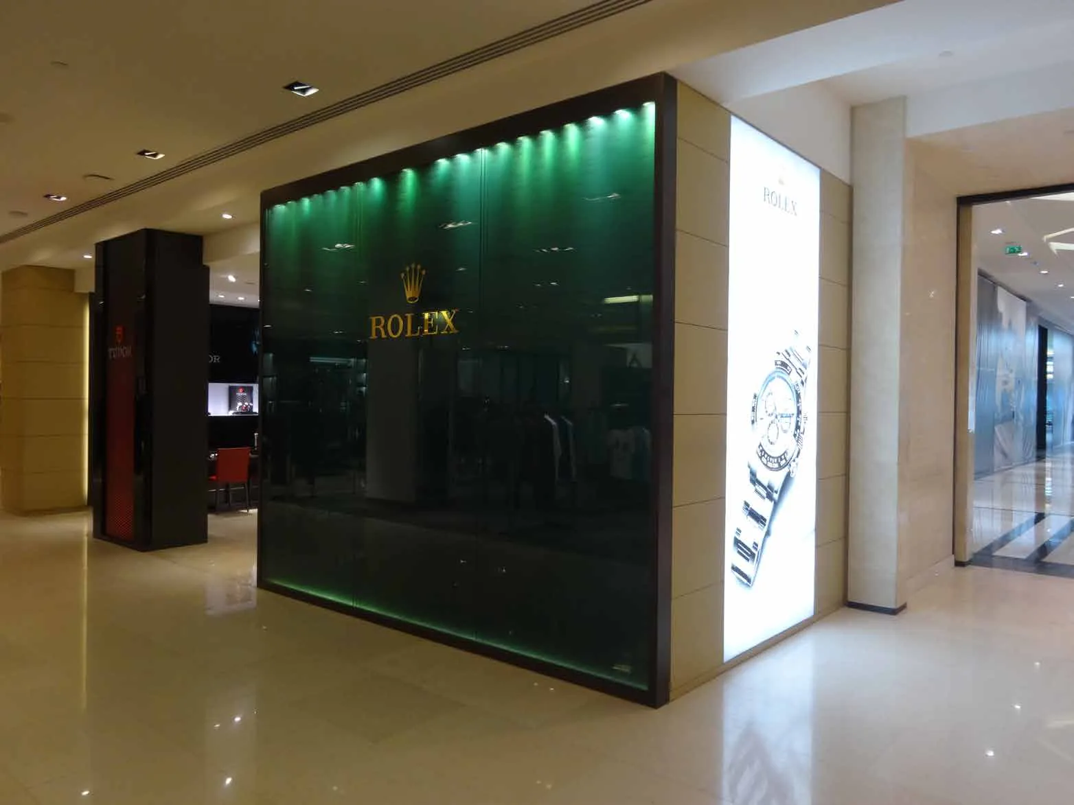 Rolex boutique facade with green display window at Lagoona Mall