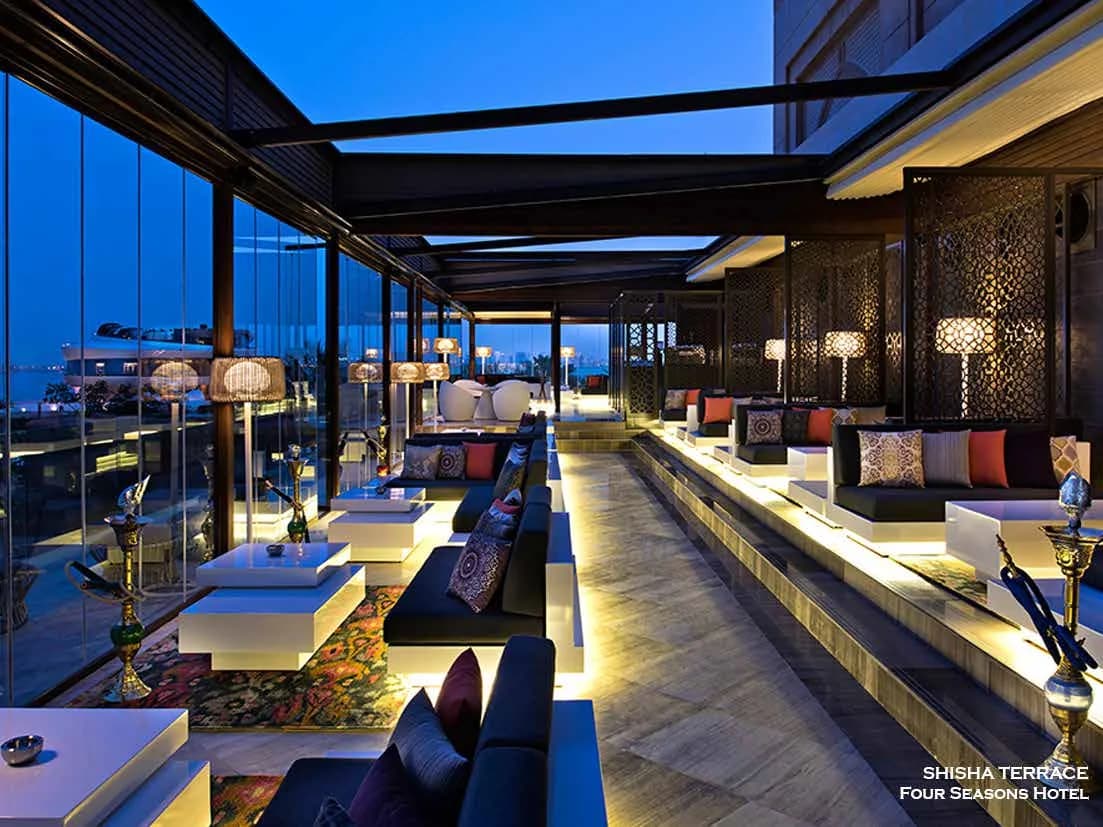Shisha Terrace at dusk with retractable roof and lounge seating
