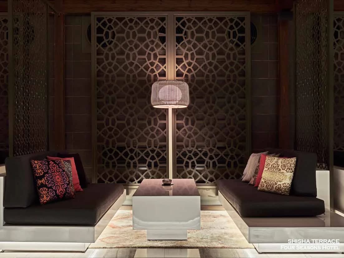 Shisha Terrace booth with mashrabiya screen separation and indirect lighting