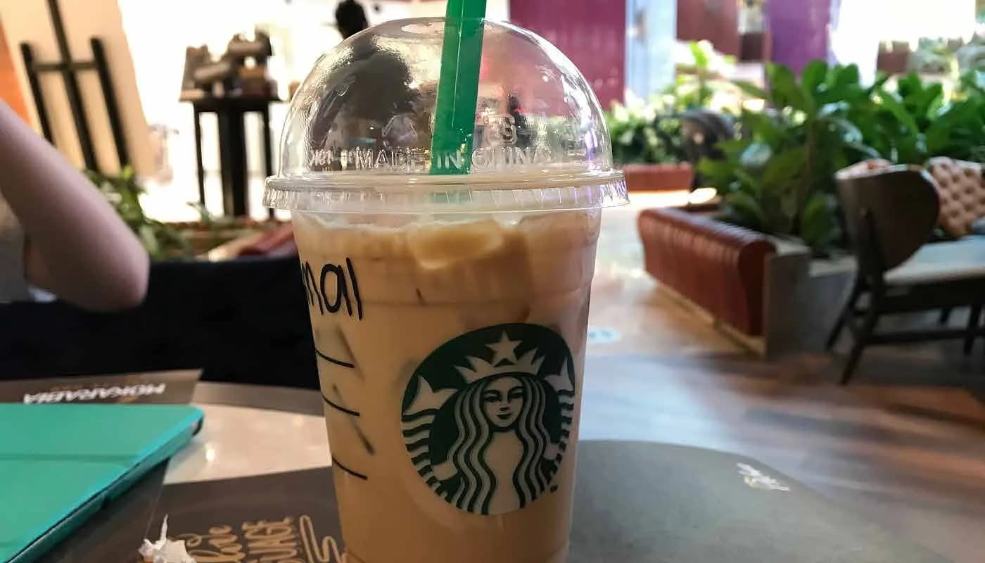 Iced Starbucks beverage on a table in the completed store