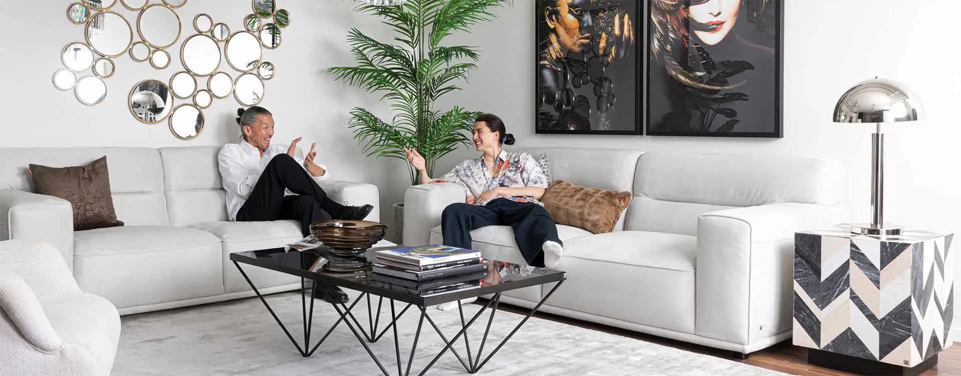 Furnished living-room vignette inside The One showroom