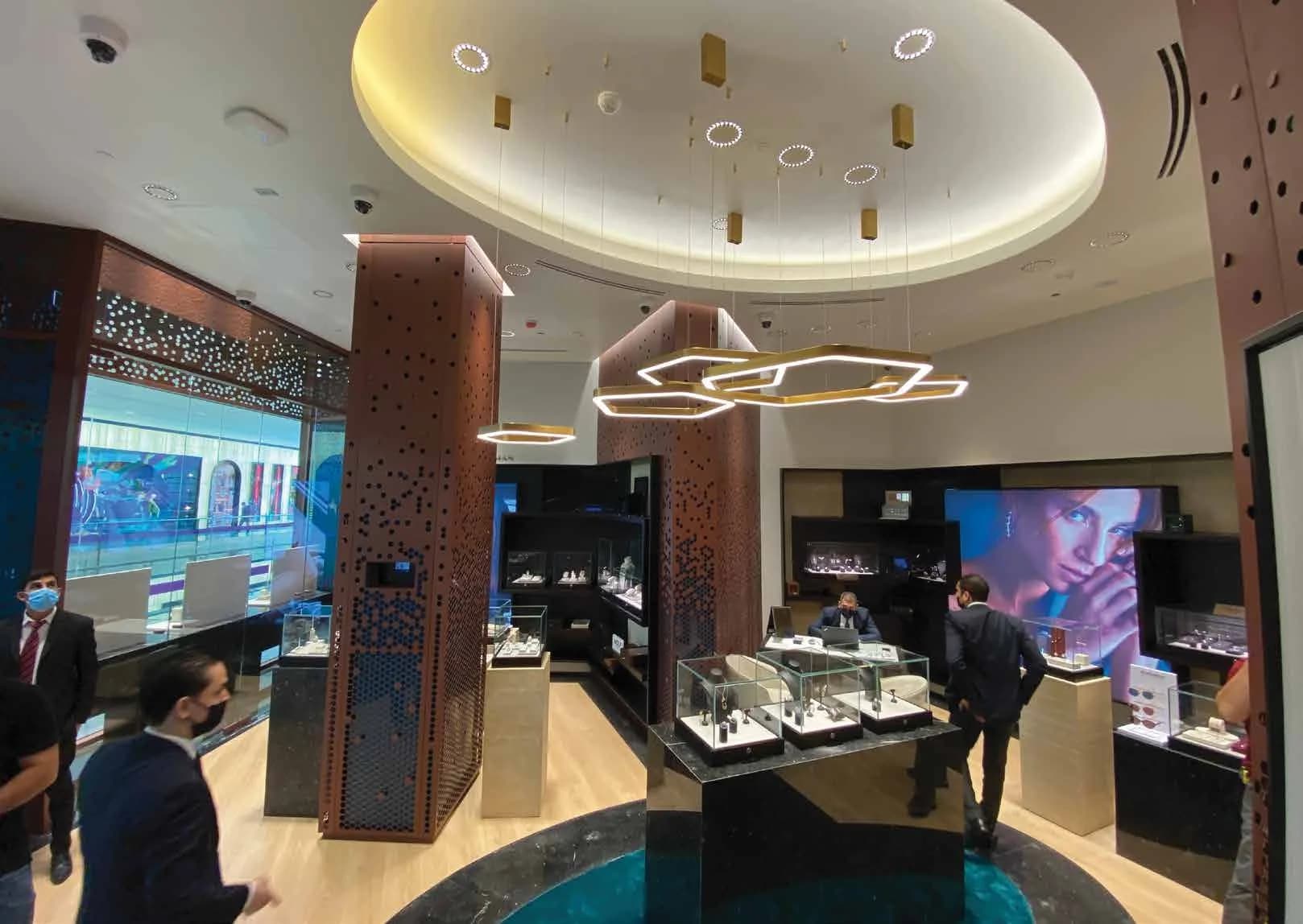 WAJ jewellery counters beneath a sculpted illuminated ceiling